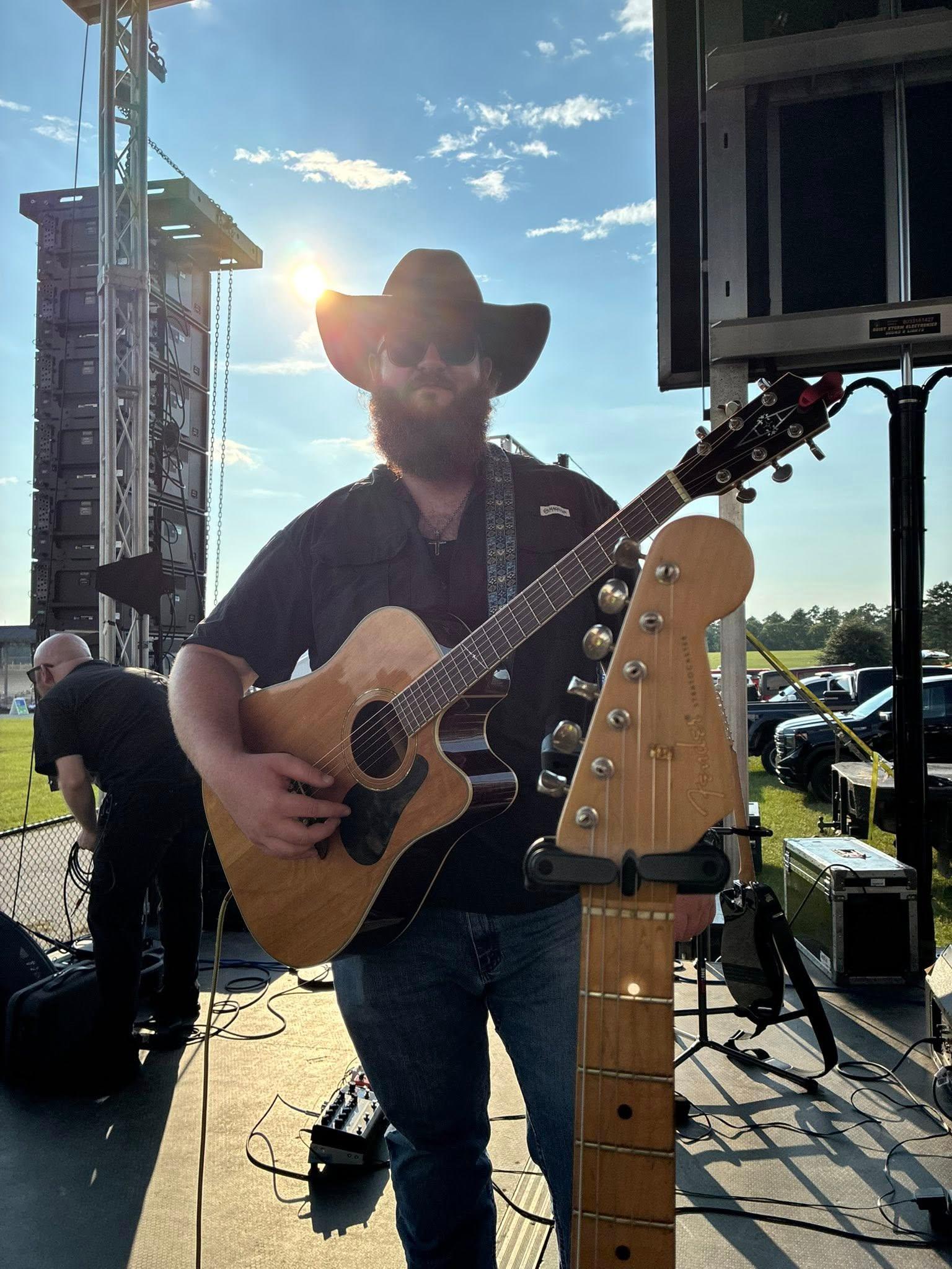 Aden Webb performing on stage